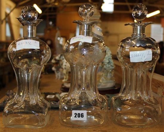 3 silver top glass decanters